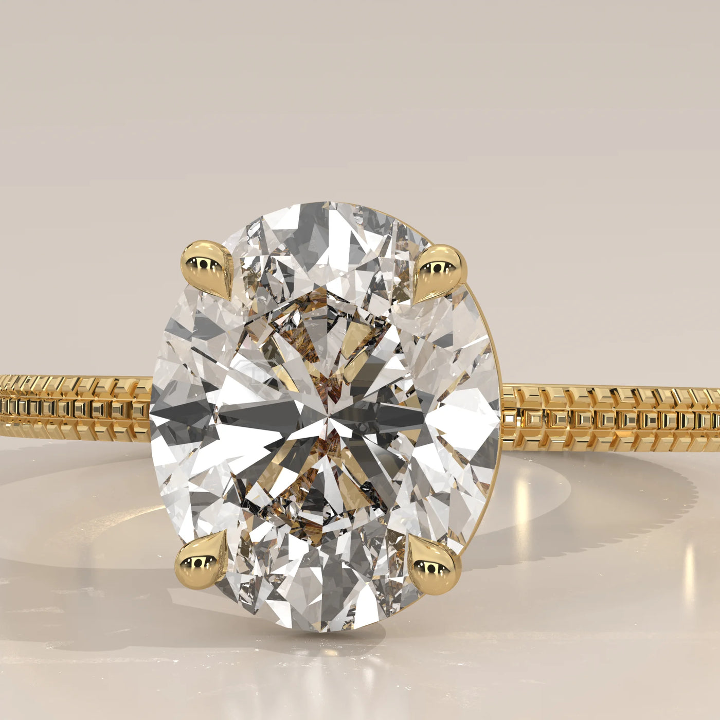 Close-up of a yellow gold ring featuring a large oval-cut diamond.