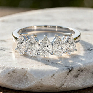 Flat Lay: Pear Cut Diamond Ring with Channel Setting in 14k White Gold - Lab Grown - Driona Jewels