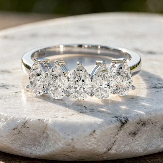 Flat Lay: Pear Cut Diamond Ring with Channel Setting in 14k White Gold - Lab Grown - Driona Jewels