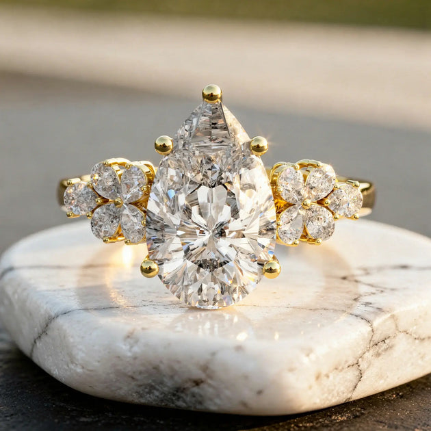 Close-up: Pear Cut Diamond Ring with Floral Setting in 14k Yellow Gold - Lab Grown - Driona Jewels