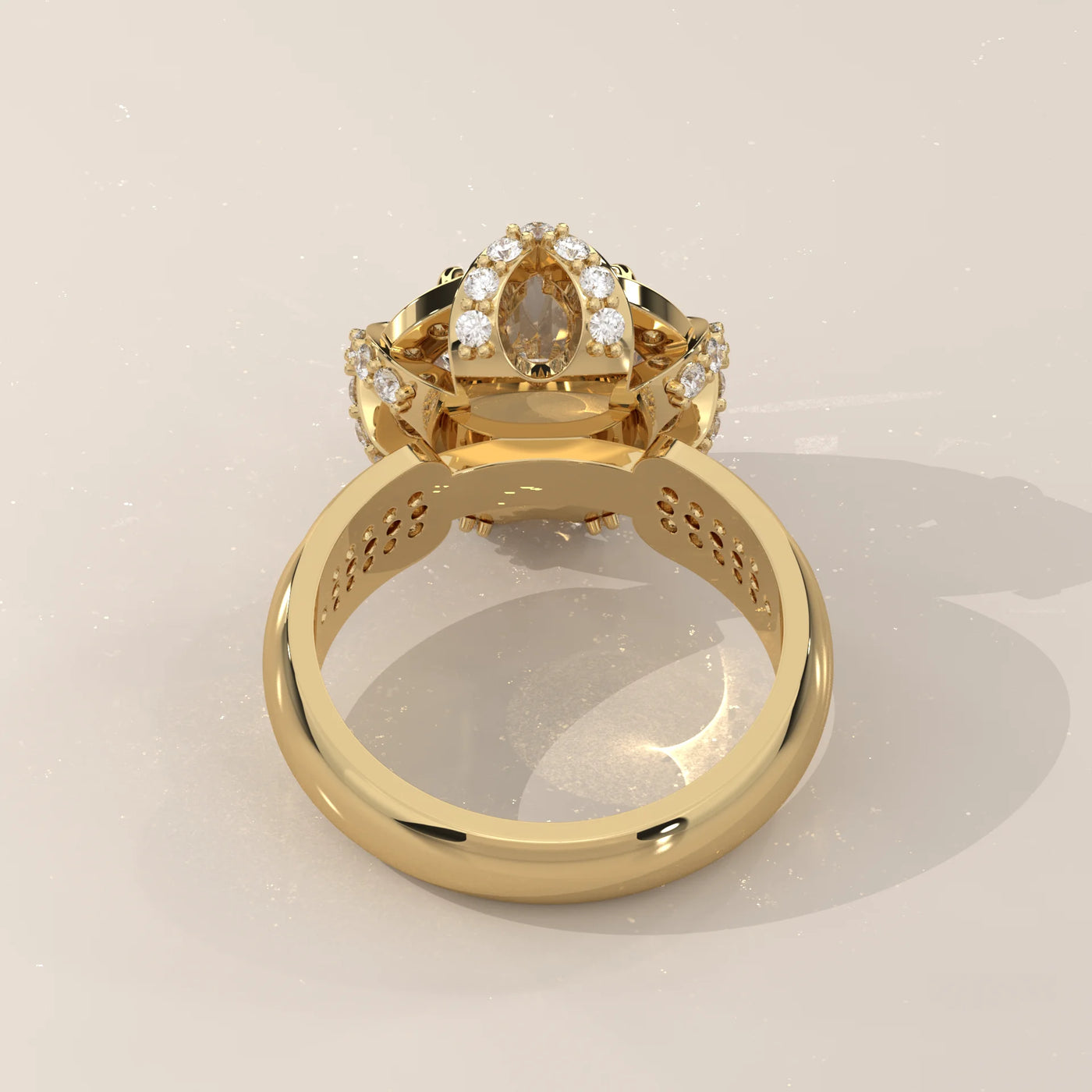 Yellow gold ring with a pear-shaped diamond and smaller accent diamonds.