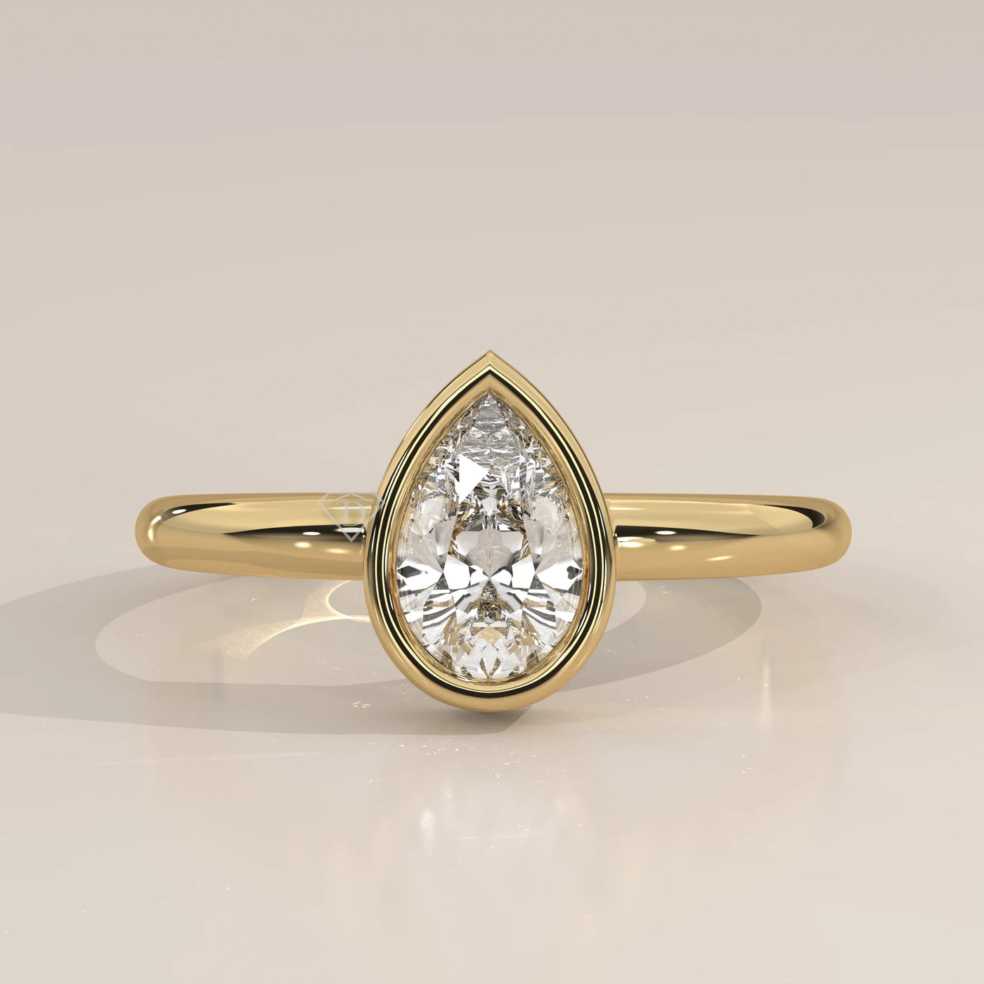 A classic 14k gold ring with a prominent pear-shaped diamond.