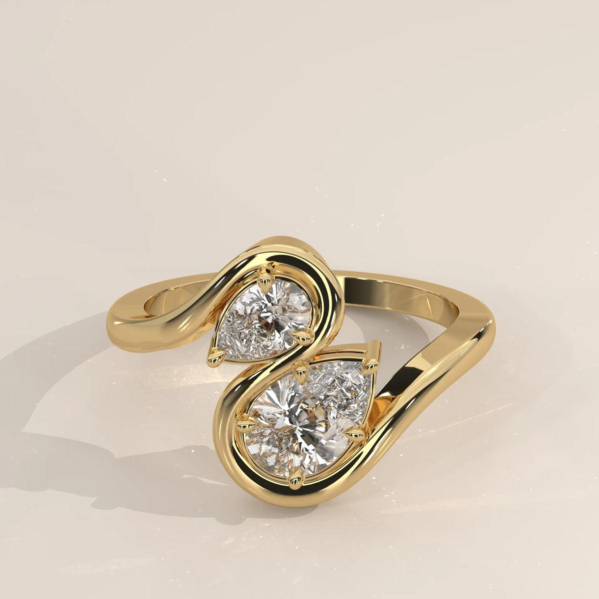 A delicate gold ring featuring a prominent pear-shaped diamond surrounded by smaller accent stones.