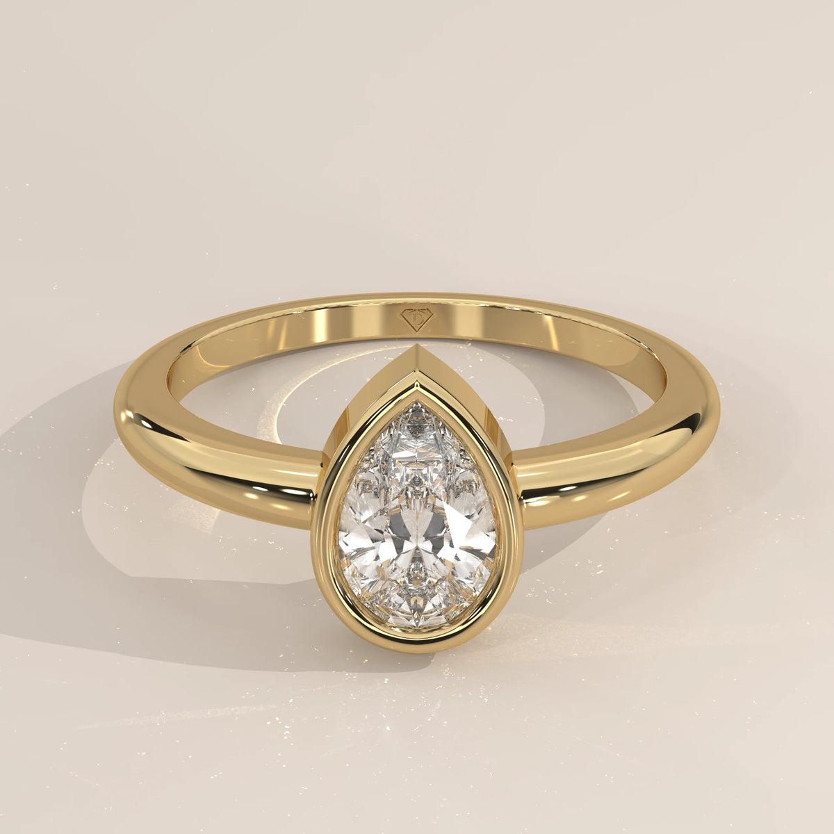 A stunning 18k gold ring featuring a prominent pear-shaped diamond.