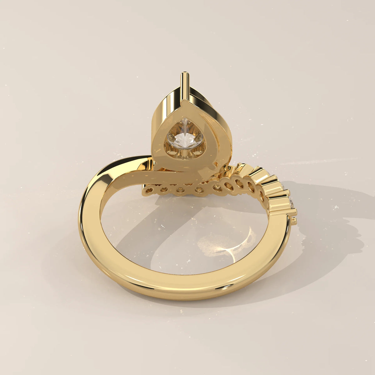 Pear Lab Grown Diamond Bypass Ring with Graduated Crescent Accents in yellow gold, side profile view.