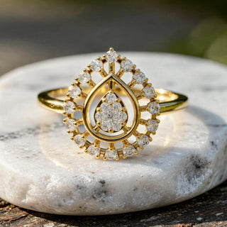 Close-up: Pear Cut Diamond Ring with Halo Setting in 14k Yellow Gold - Lab Grown - Driona Jewels