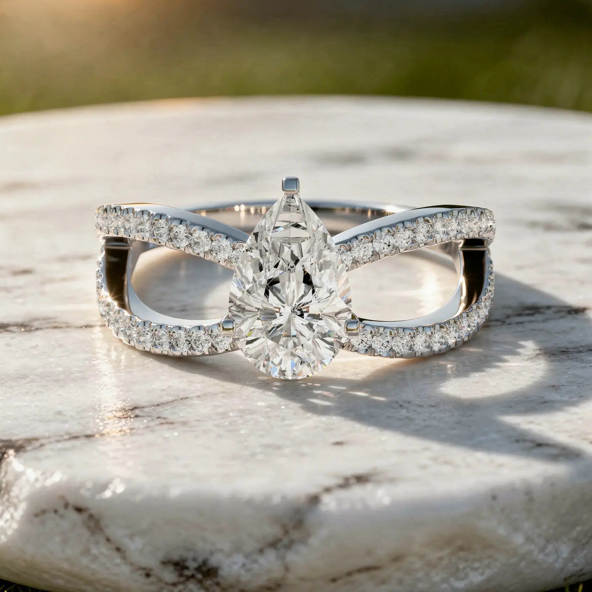 Flat Lay: Pear Cut Diamond Ring with Split Shank Setting in 14k White Gold - Lab Grown - Driona Jewels