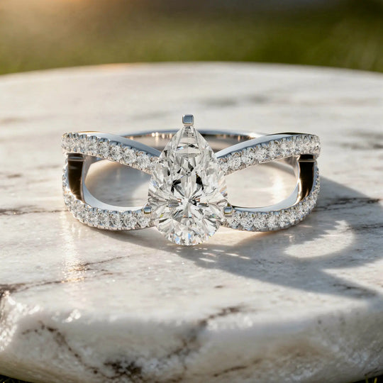 Flat Lay: Pear Cut Diamond Ring with Split Shank Setting in 14k White Gold - Lab Grown - Driona Jewels