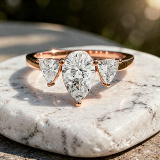 Front-view: Pear Cut Diamond Ring with Three-Stone Setting in 14k Rose Gold - Lab Grown - Driona Jewels