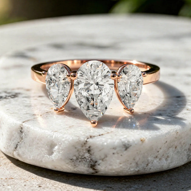 Front-view: Pear Cut Diamond Three Stone with Three-Stone Setting in 14k Rose Gold - Lab Grown - Driona Jewels
