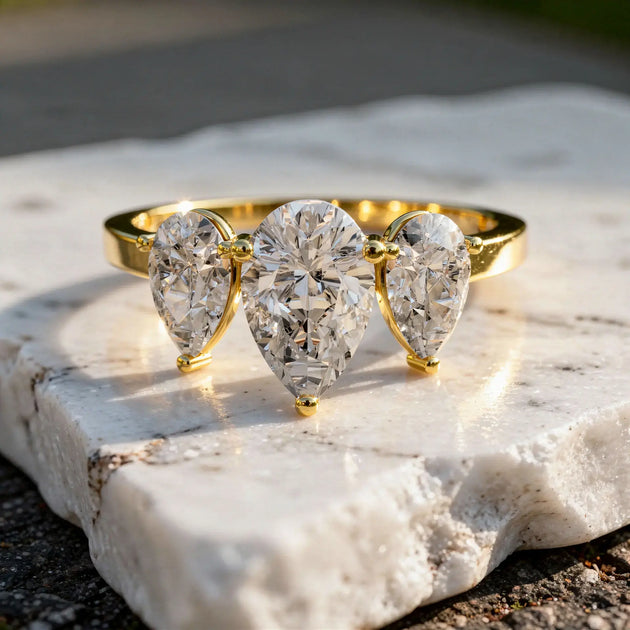 Front-view: Pear Cut Diamond Three Stone Ring with Three-stone Setting in 14k Yellow Gold - Lab Grown - Driona Jewels