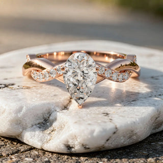 Front-view: Pear Cut Diamond Ring with Twisted Setting in 14k Rose Gold - Lab Grown - Driona Jewels