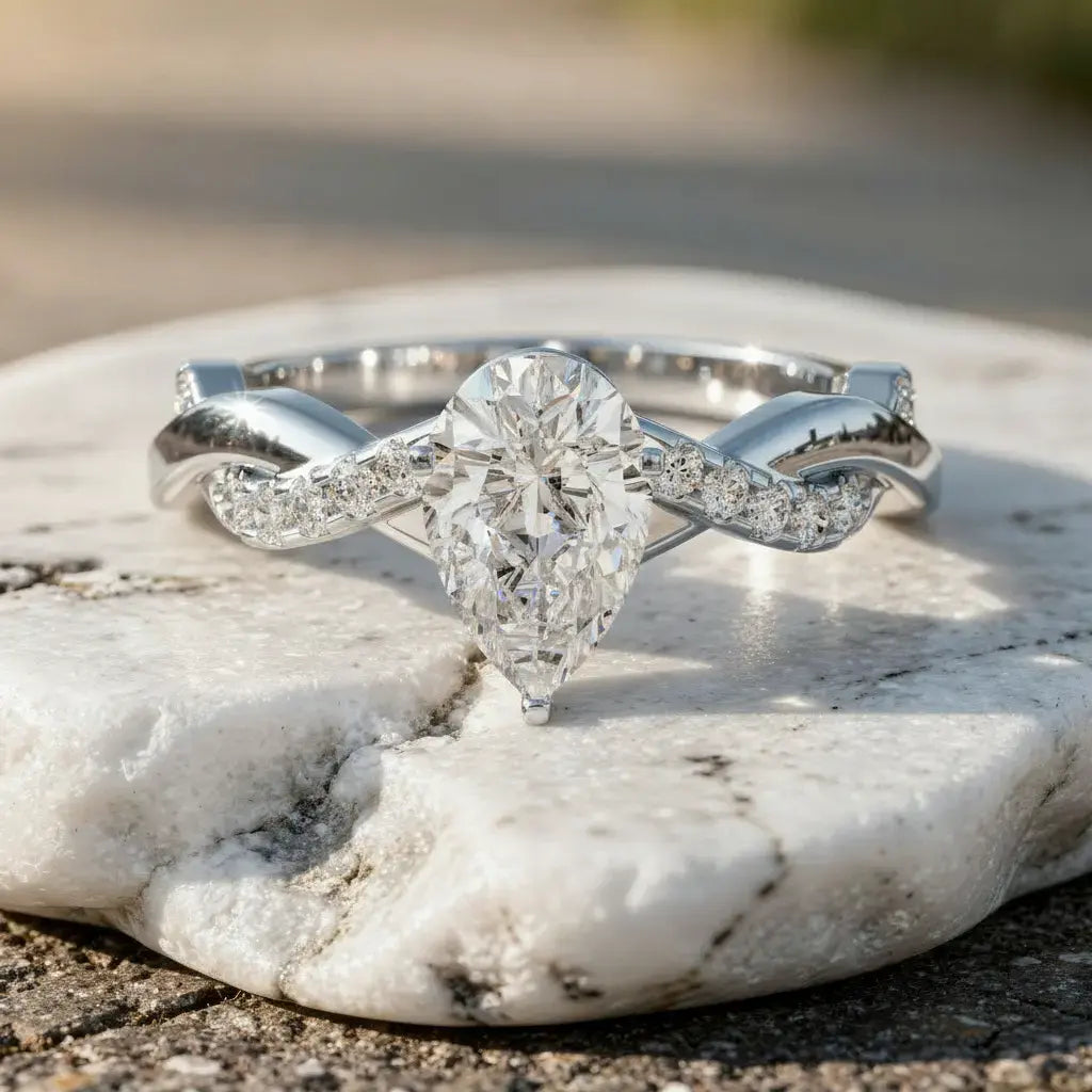 Close-up: Pear Cut Diamond Ring with Twisted Setting in 14k White Gold - Lab Grown - Driona Jewels