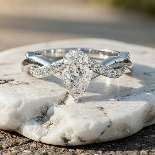 Close-up: Pear Cut Diamond Ring with Twisted Setting in 14k White Gold - Lab Grown - Driona Jewels