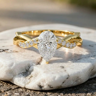 Front-view: Pear Cut Diamond Ring with Twisted Setting in 14k Yellow Gold - Lab Grown - Driona Jewels