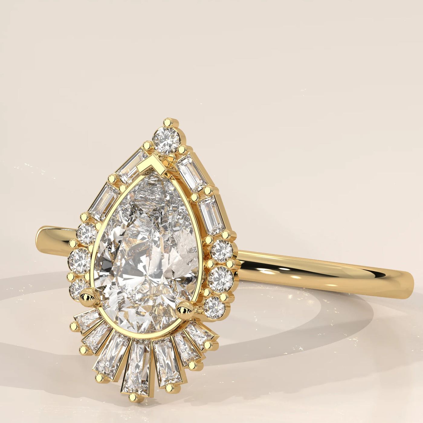 A 14k yellow gold ring with a pear-shaped diamond.