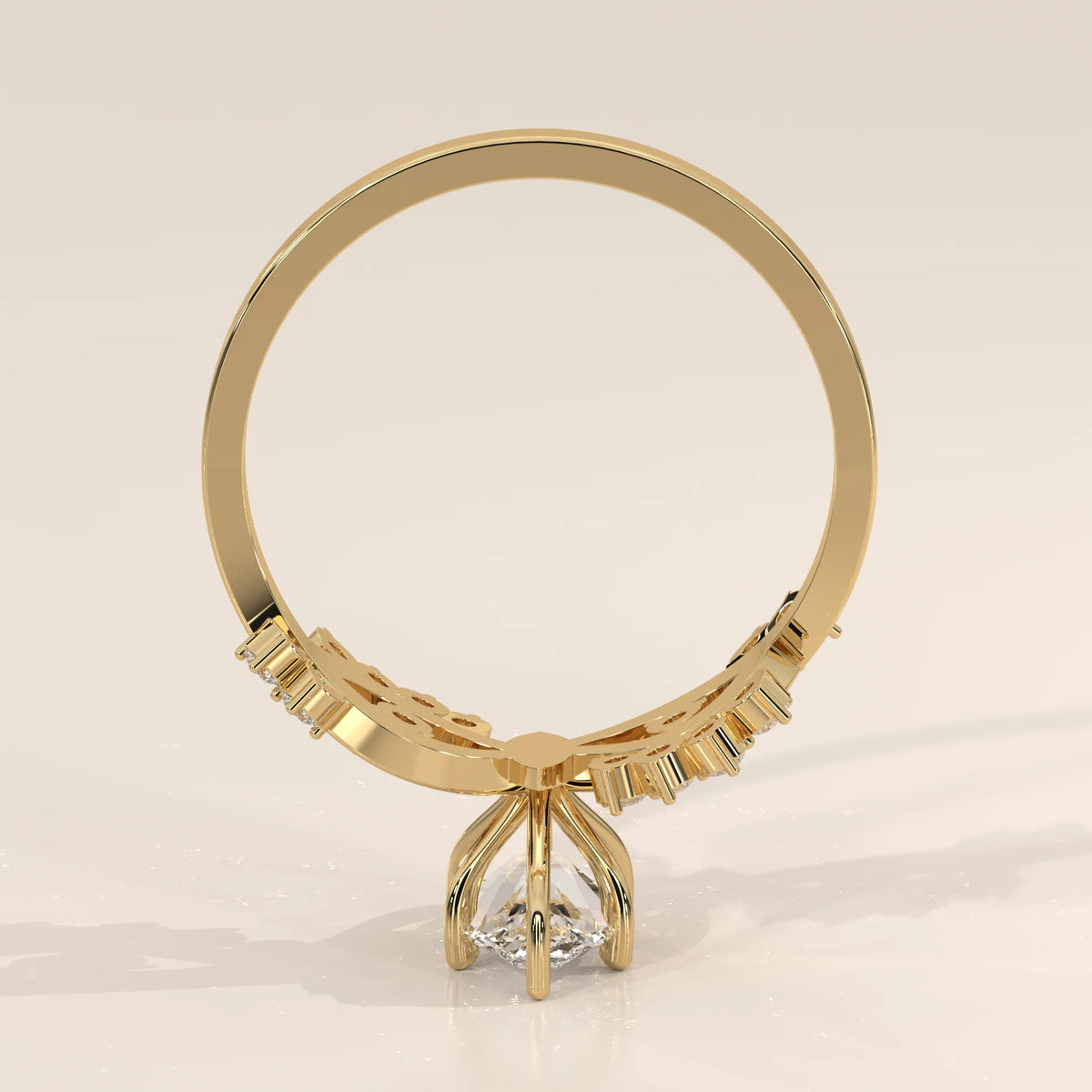 Yellow gold ring with a pear-shaped diamond and decorative band.