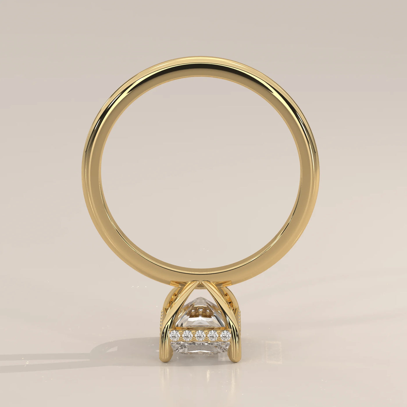 Yellow gold ring with a princess-cut diamond and pavé band.