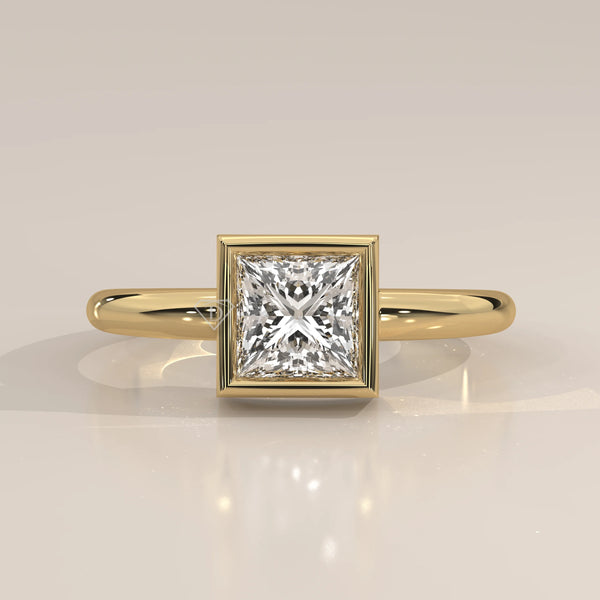 A yellow gold ring with a princess-cut diamond in a bezel setting.