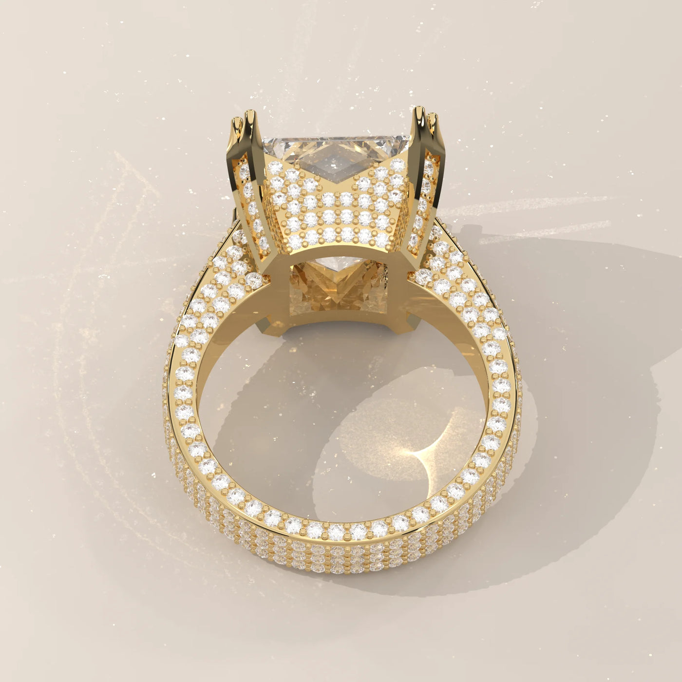 A luxurious 14k yellow gold ring with a large princess-cut diamond surrounded by smaller stones.
