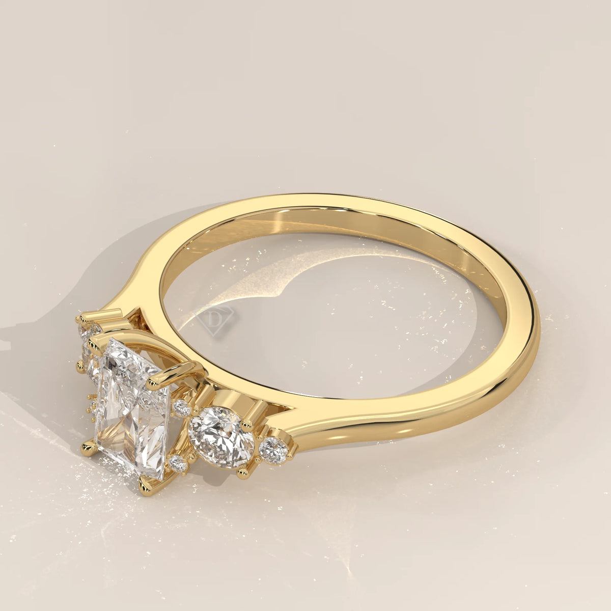 Yellow gold ring with a princess-cut center diamond and smaller accent stones.