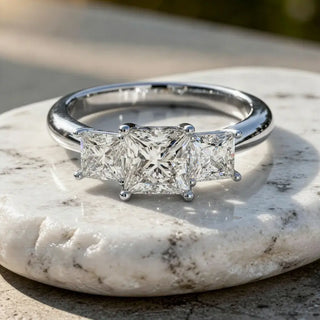 Flat-Lay: Princess Diamond Ring with Three-Stone Setting in 14k White Gold - Lab Grown - Driona Jewels