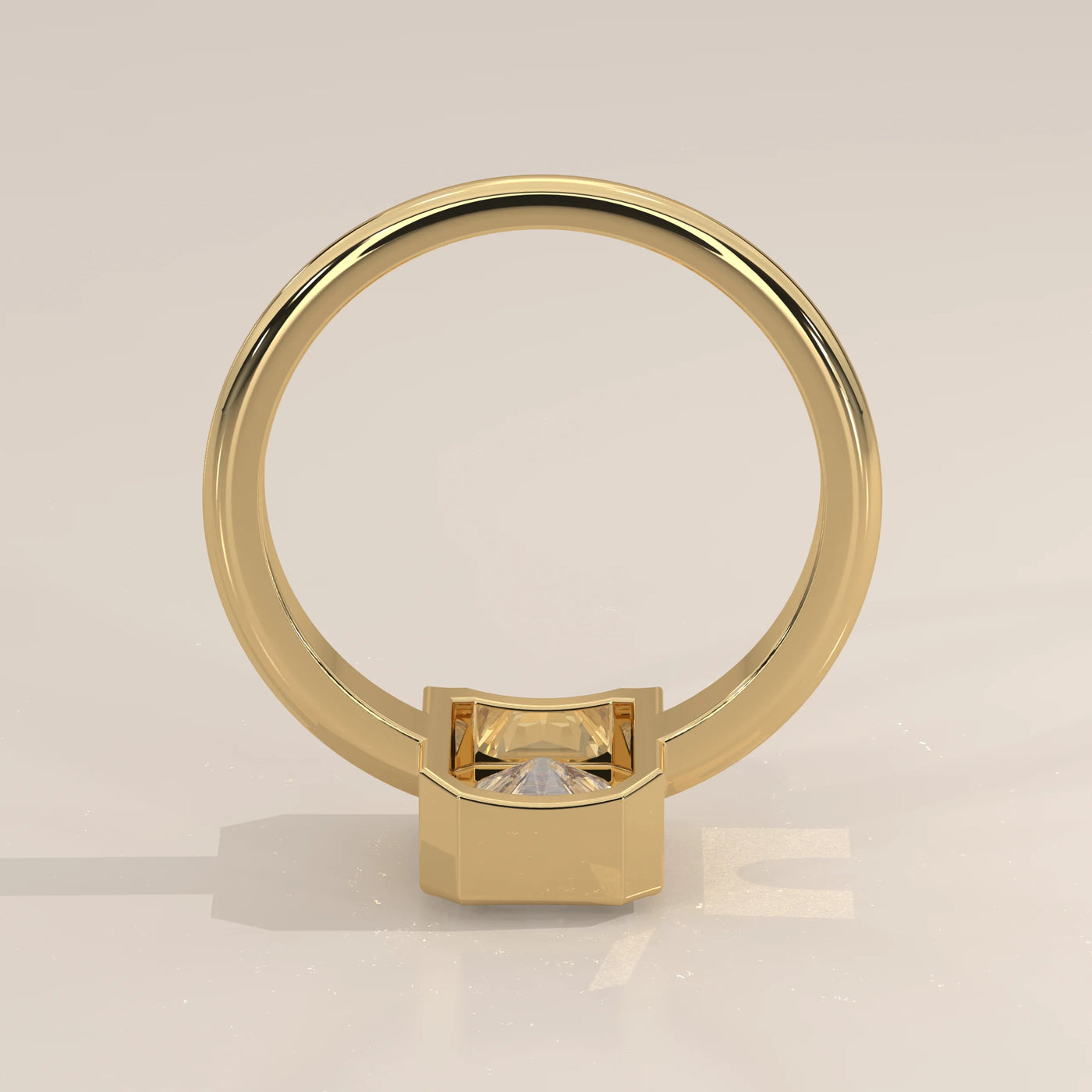 A simple 14k yellow gold ring with a princess cut diamond.