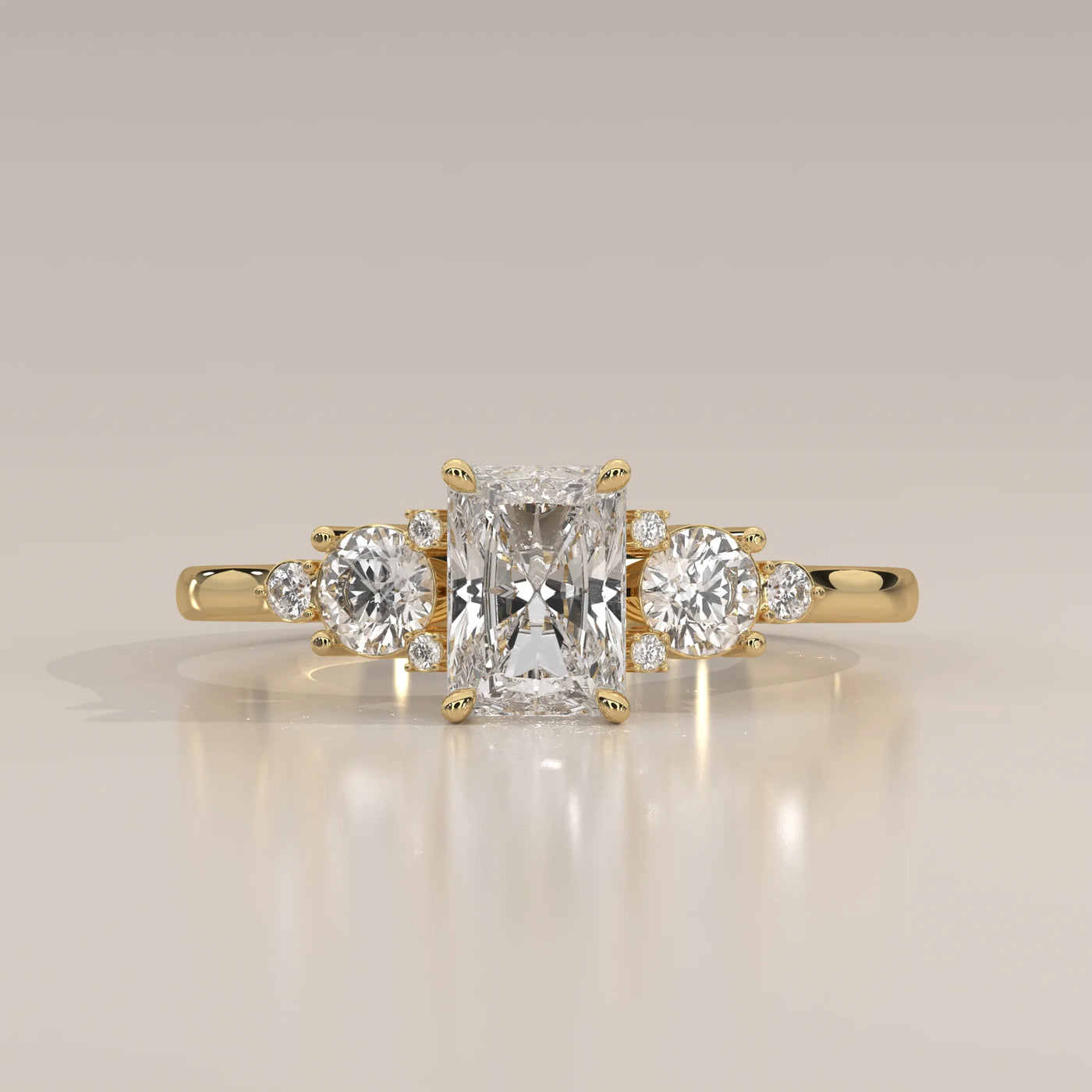 A radiant cut diamond engagement ring in 14k yellow gold.