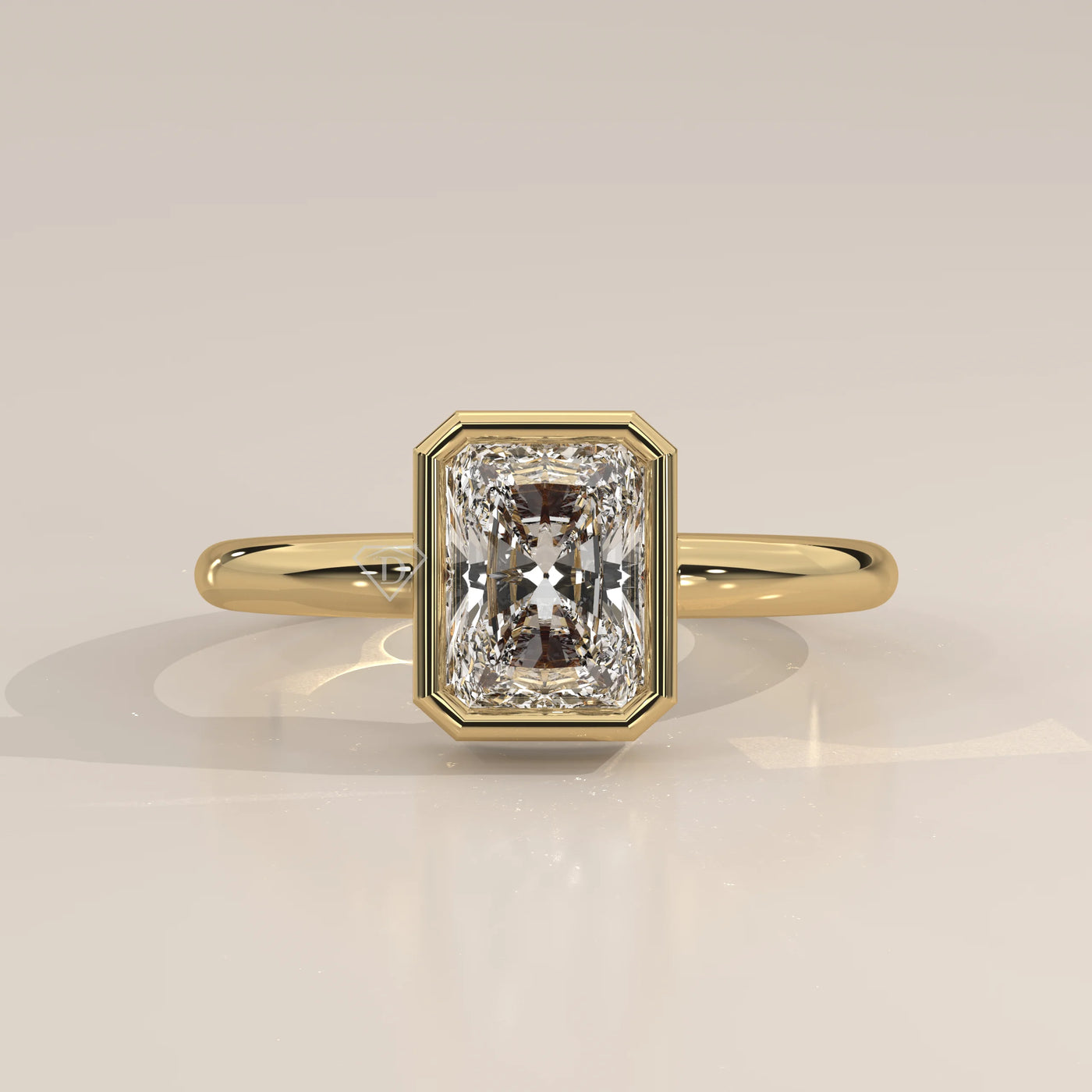 A yellow gold ring with a radiant cut diamond.