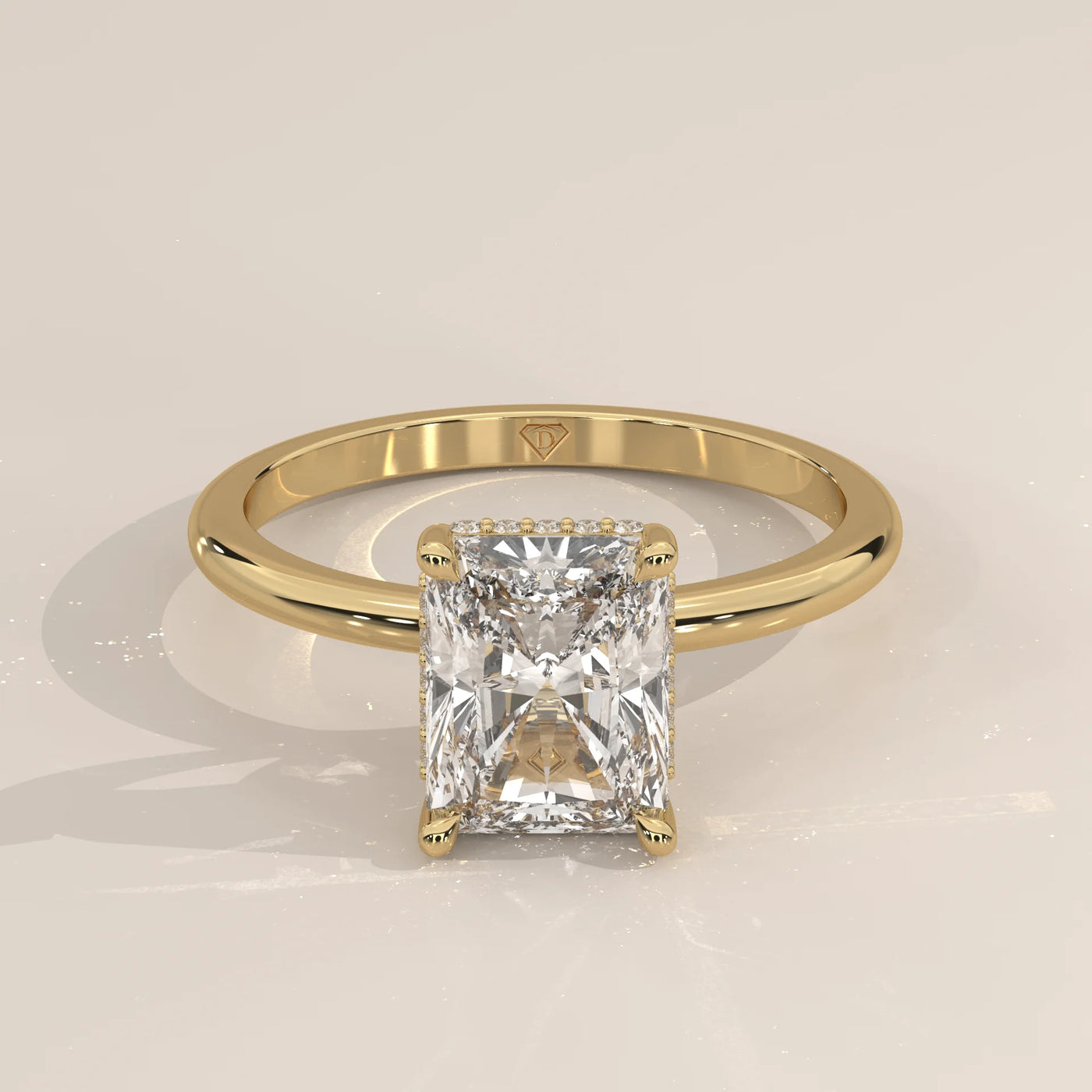 A classic yellow gold ring with a radiant cut diamond.