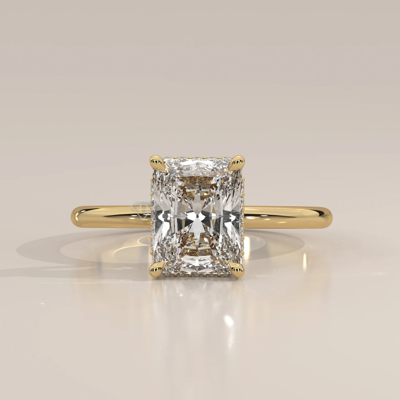 A classic yellow gold ring with a radiant cut diamond.