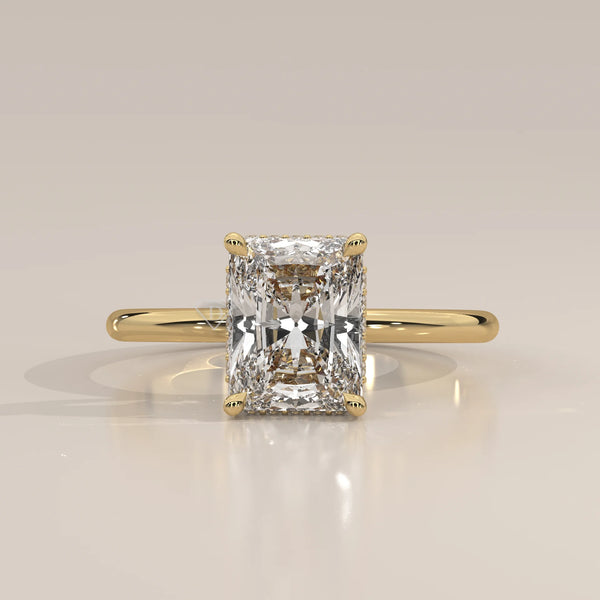 A classic yellow gold ring with a radiant cut diamond.