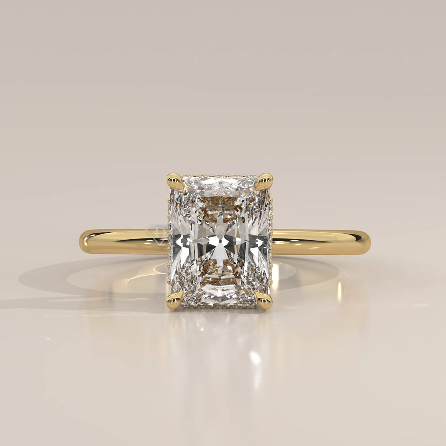 A classic yellow gold ring with a radiant cut diamond.