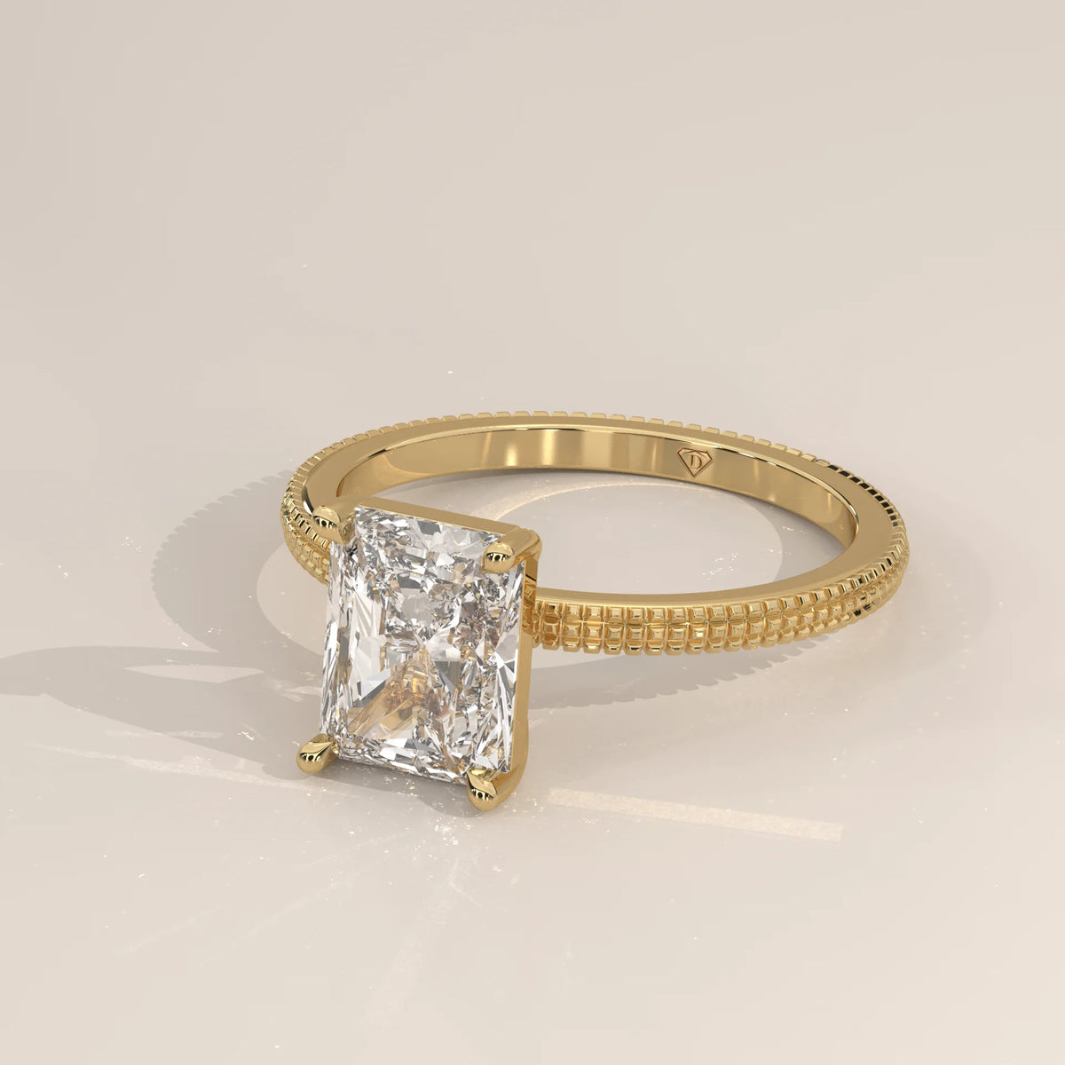 A yellow gold ring with a radiant cut diamond.