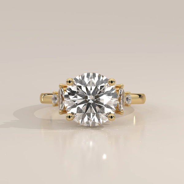 Round Lab Grown Diamond Ring with Marquise and Round Side Accents in yellow gold, photographed head-on.