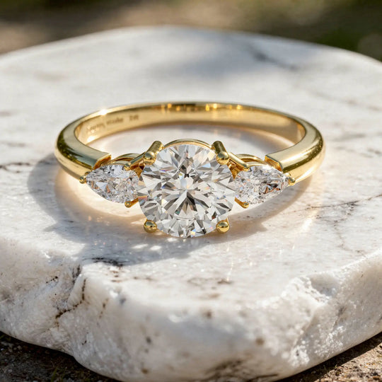 Flat Lay: Round Diamond Ring with Three Stone Setting in 14k Yellow Gold - Lab Grown - Driona Jewels