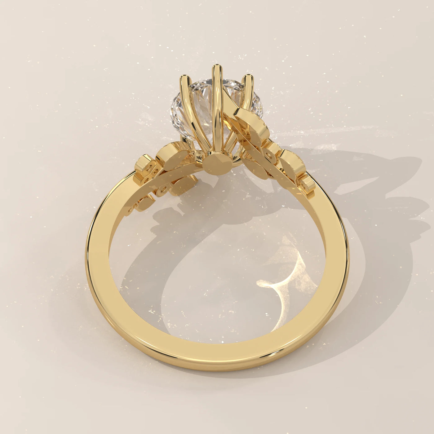 A yellow gold ring with a round diamond and leaf accents.