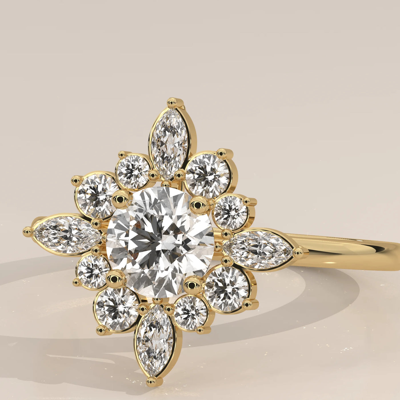 A round and marquise diamond engagement ring in 14k yellow gold.