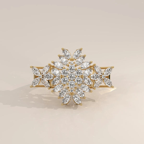 A sparkling snowflake-shaped ring with diamonds set in yellow gold.