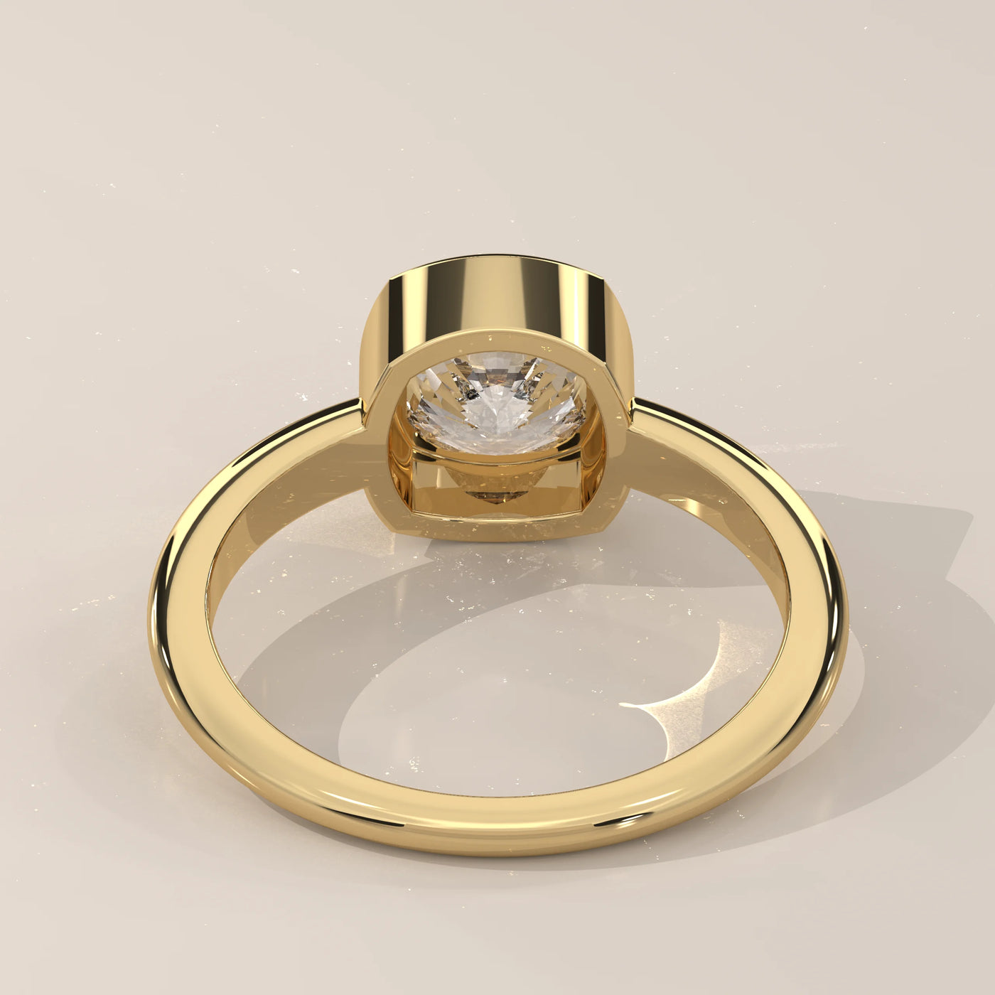 A 14k yellow gold ring with a large center diamond and pavé band.