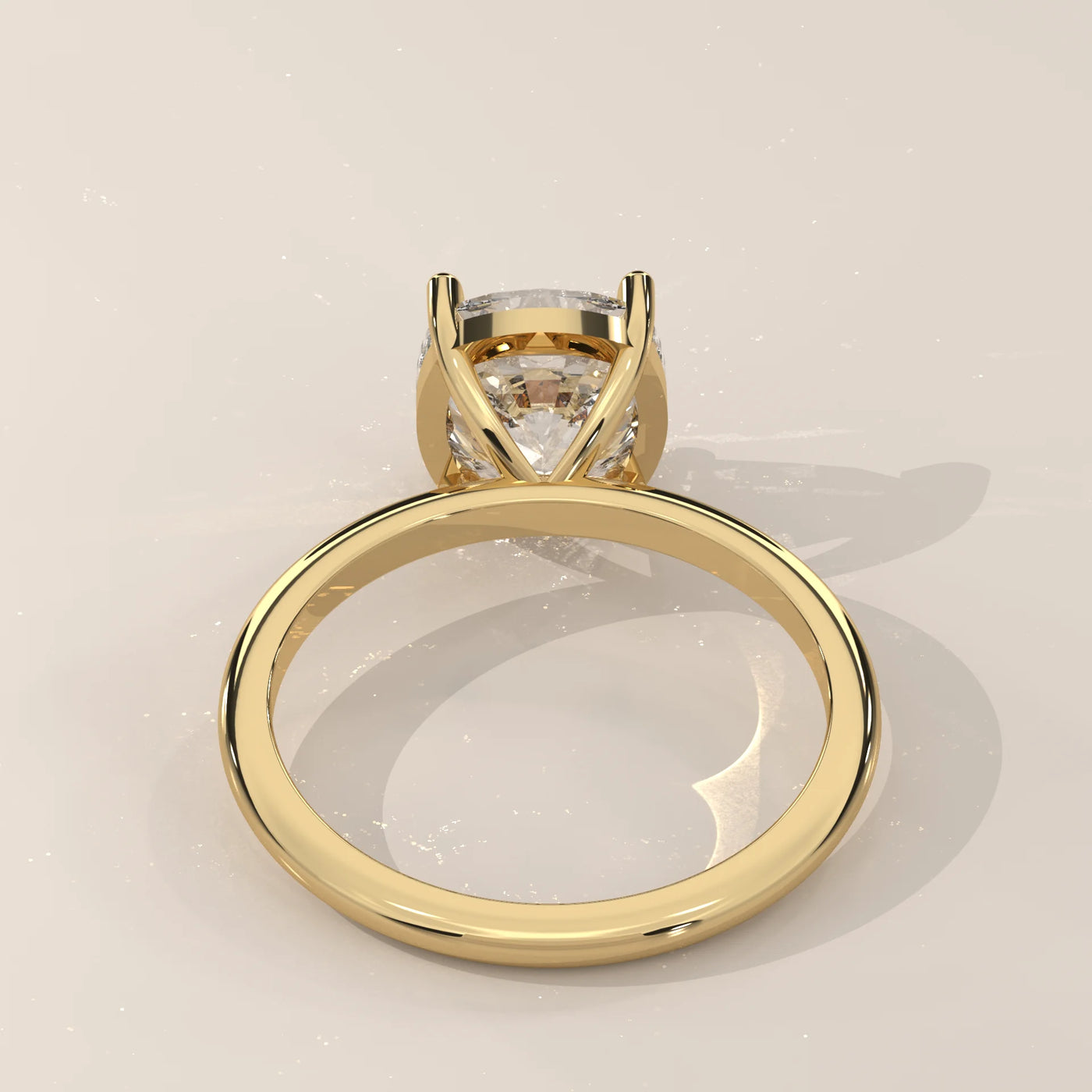 A classic 14k gold solitaire ring with a cushion-cut diamond.