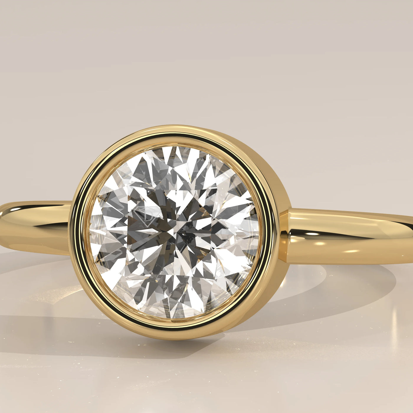 Close-up of a classic solitaire diamond ring in 14k yellow gold.
