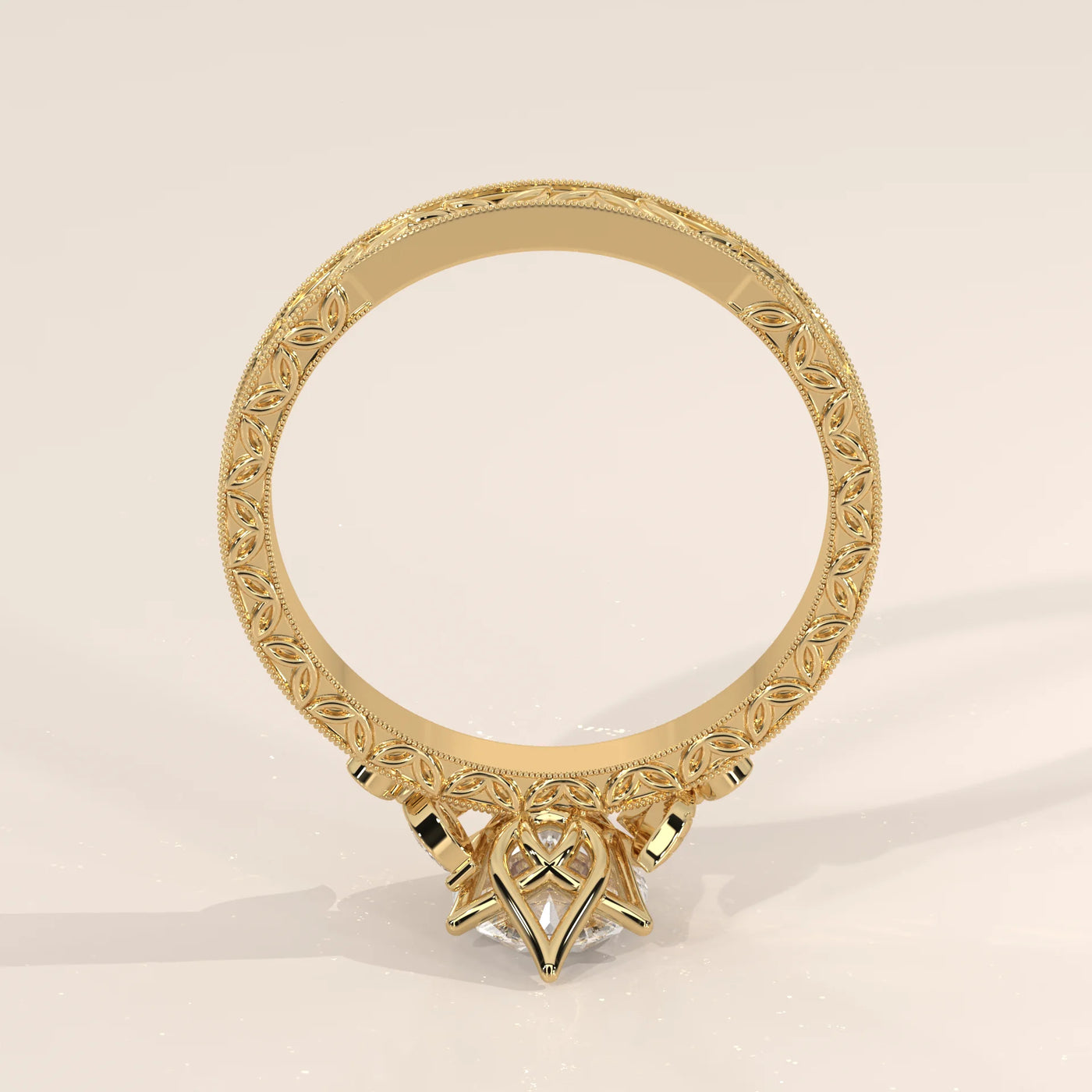 Yellow gold ring with intricate detailing and a prominent center stone.
