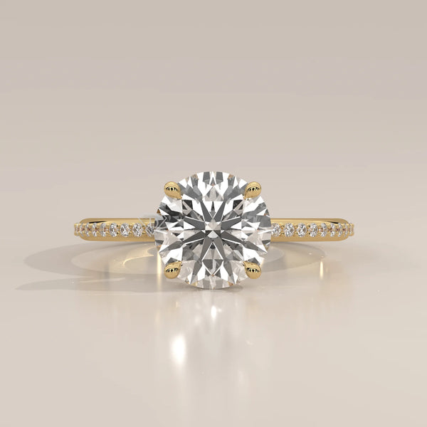 A classic solitaire diamond ring with a 14k gold band.