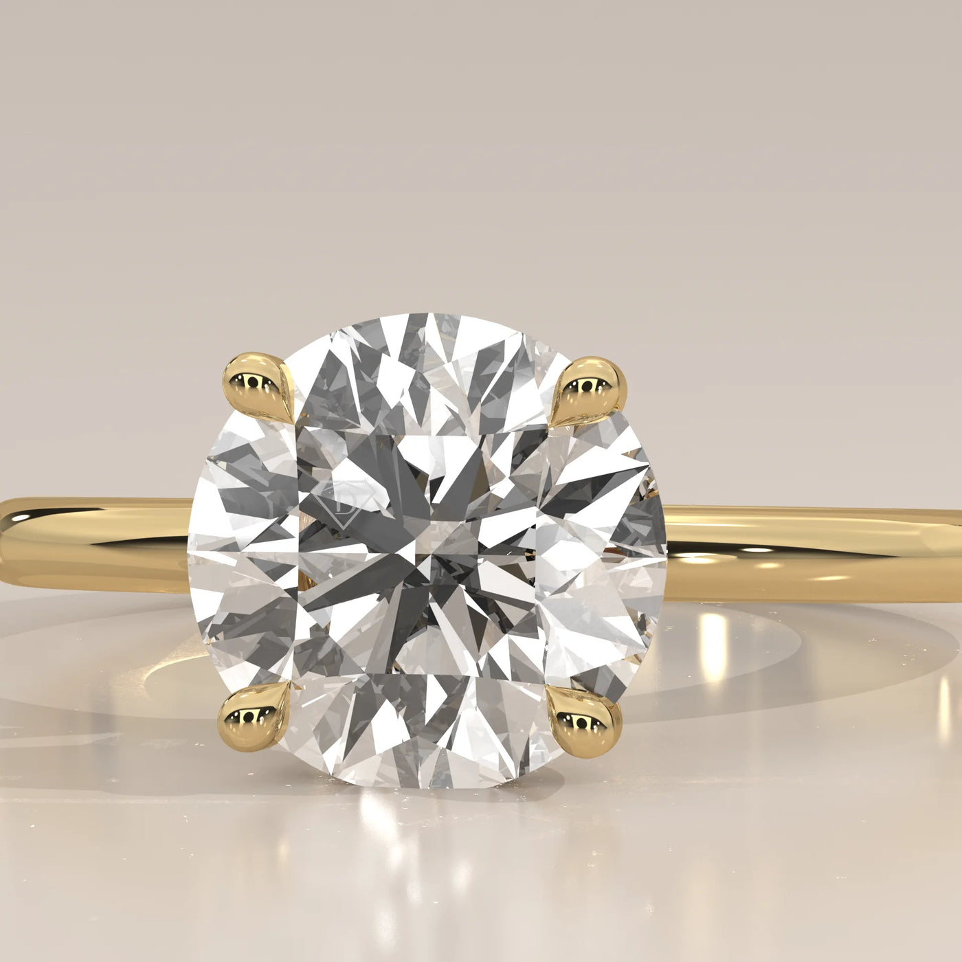 A classic solitaire diamond ring with a 14k gold band.