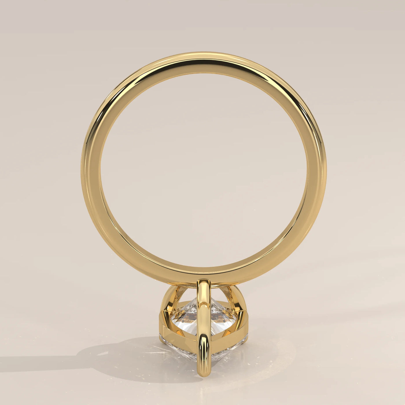 A gold ring with a central diamond set in a hexagonal bezel setting.