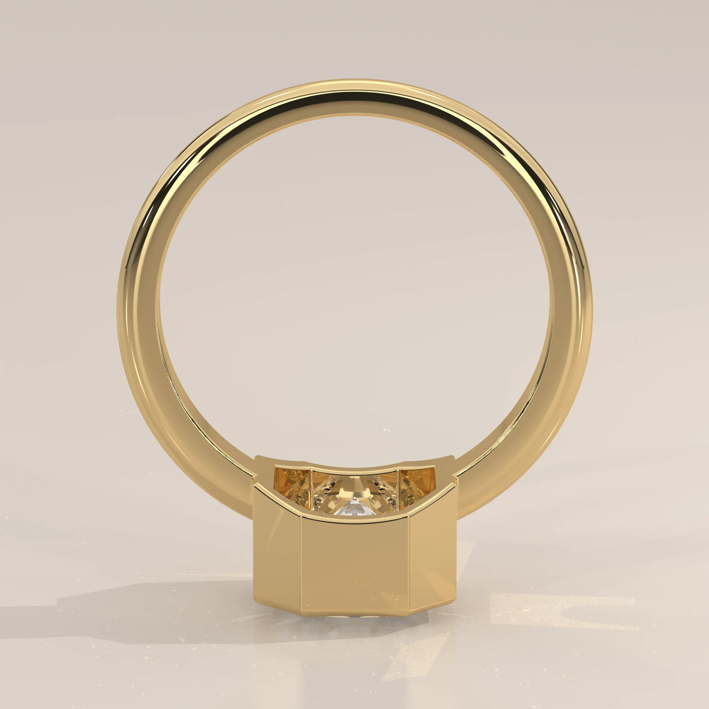 A gold ring with a central diamond set in a hexagonal bezel setting.