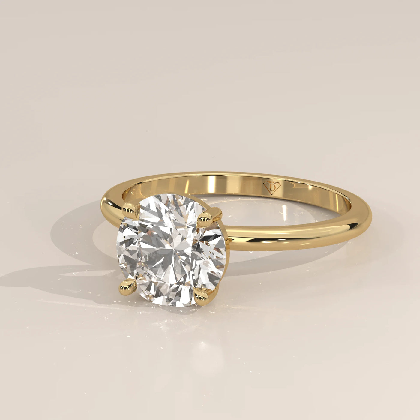 A classic 14k yellow gold ring with a large diamond and pave band.