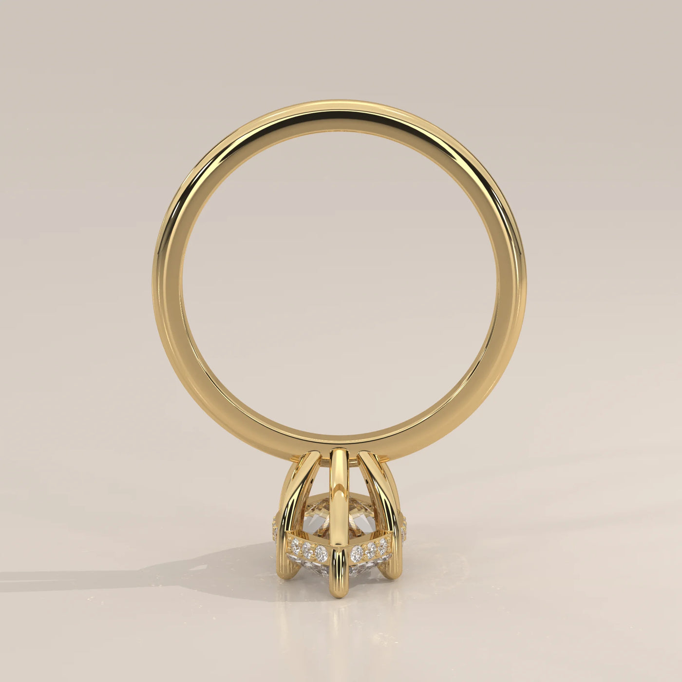 A classic 14k yellow gold ring with a large diamond and pave band.