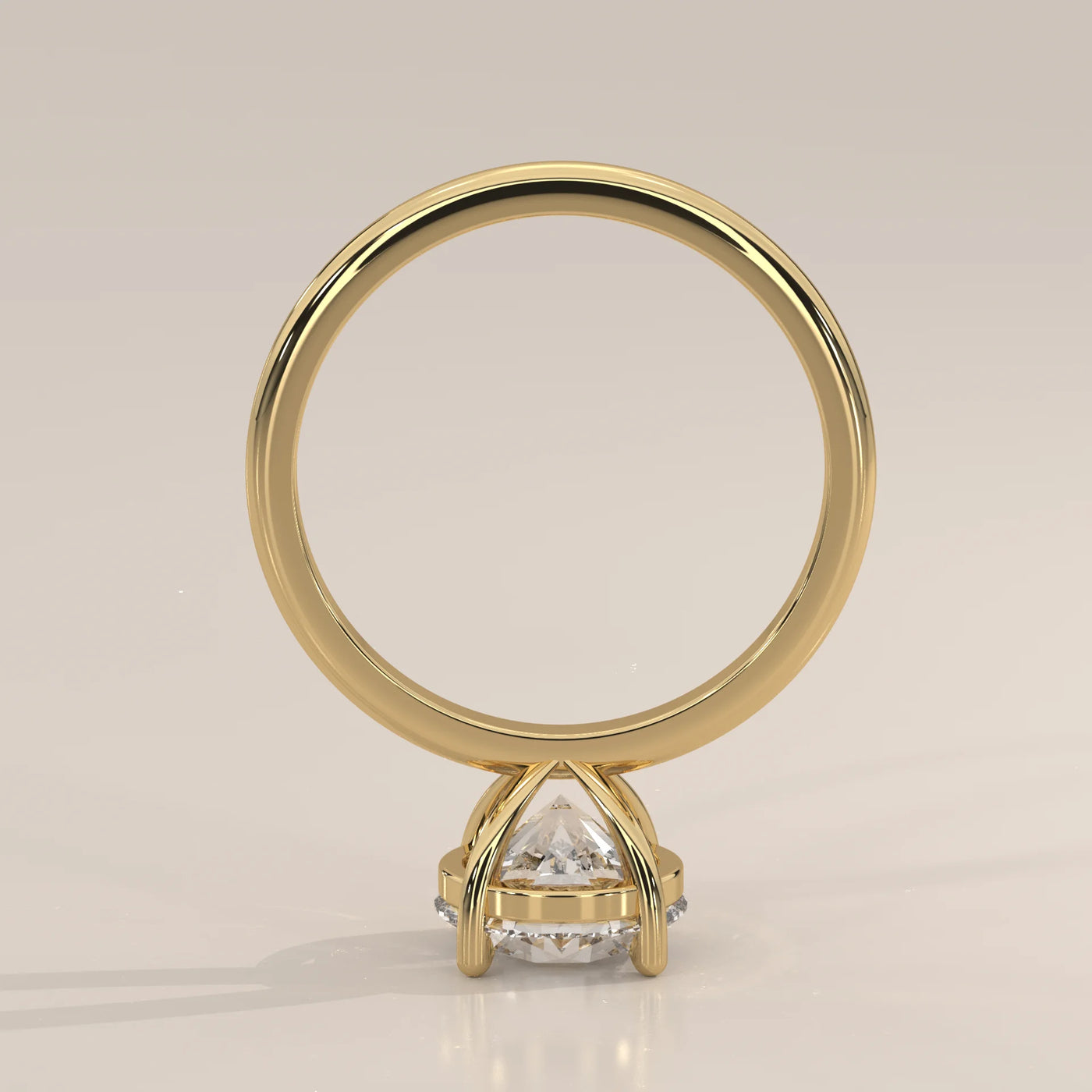 A classic 14k yellow gold ring with a large diamond and pave band.